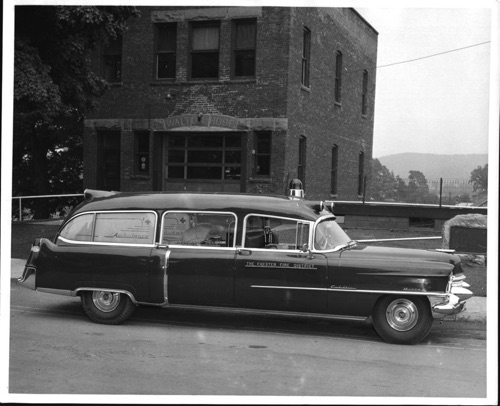 The new Chester Fire District Ambulance in front of the old Walton Hose Fire house. ~1955. chs-001076